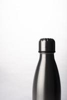 Metal water bottle on white background, Stainless steel flask photo