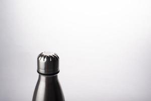 Metal water bottle on white background, Stainless steel flask photo