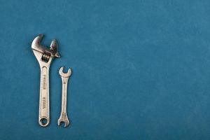 Set of tools on blue background as labour day background photo