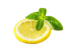 Fresh juicy lemon with mint on white background. photo