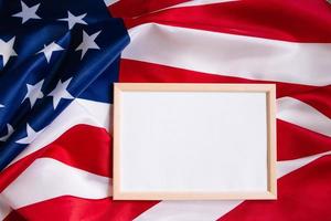 American flag and empty frame for text. Independence, Memorial Day. photo