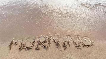 Soft waves on the beach with morning text video