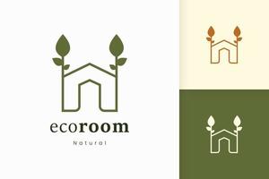 logotipo de la casa verde natural con forma de árbol y hoja vector