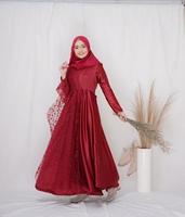 Beautiful islamic female model wearing hijab fashion, a modern lifestyle outfit for muslim woman. Concept a wedding dress, beauty or eidul fitri. A asian girl model wearing hijab on indoor photoshoot photo