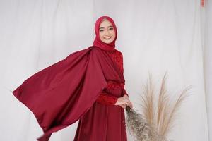 Beautiful islamic female model wearing hijab fashion, a modern lifestyle outfit for muslim woman. Concept a wedding dress, beauty or eidul fitri. A asian girl model wearing hijab on indoor photoshoot photo