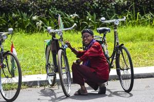 Bekasi, West Java, Indonesia, March 5th 2022. An old style javanese cleaning antique bicycle photo