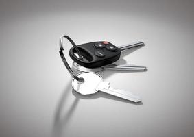 Modern Car keys for passenger vehicle isolated on flat white surface. photo
