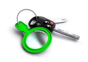 Car keys with a green magnifying glass as a keyring photo