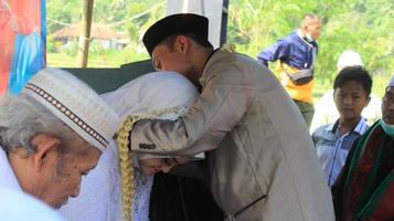 Cianjur Regency, West Java, Indonesia on June 12, 2021, Delivery of the dowry from the groom to the bride. Islamic wedding culture in Indonesia. photo