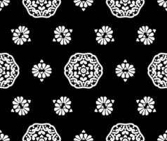 patrón de vectores florales sin fisuras. patrones redondos en blanco y negro sobre un fondo negro. textura vintage para tela, azulejo, papel pintado o embalaje.