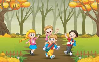 niños que van a la escuela a través de un sendero forestal de otoño vector