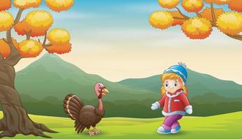 Happy little girl with turkey bird in the garden vector