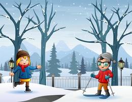 niños alegres jugando en el paisaje nevado de invierno vector