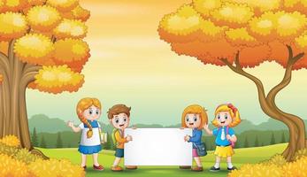 Autumn park landscape with school kids holding blank sign vector
