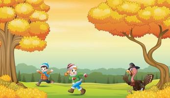 Happy kids playing with turkey bird in the autumn landscape vector