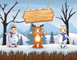 Happy kids in animal costume on snowy forest landscape vector