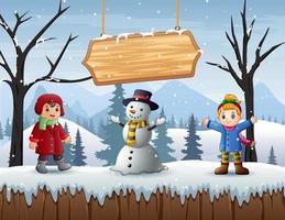 Happy boy and girl standing with snowman in winter outdoors vector