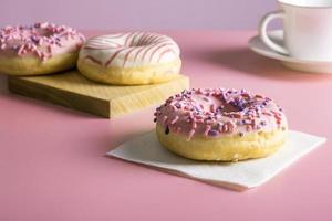 Three delicious fresh glazed donuts photo