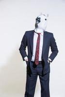 man with a horse mask on a light background photo