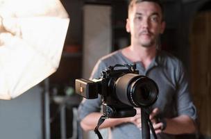 photographer in the process of shooting in the Studio photo