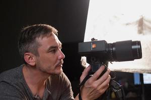 photographer in the process of shooting in the Studio photo