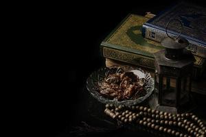 prayer beads with date palm on black background photo