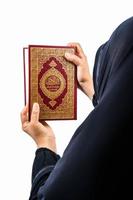 Koran in hand  holy book of Muslims public item of all muslims Koran in hand muslims woman photo