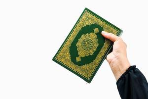 Koran in hand  holy book of Muslims public item of all muslims Koran in hand muslims woman photo