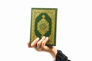 Koran in hand  holy book of Muslims public item of all muslims photo