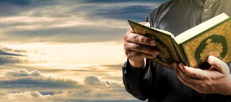 Koran in hand  holy book of Muslims  public item of all muslims photo