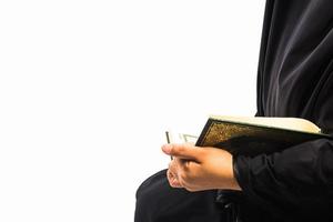 Koran in hand  holy book of Muslims public item of all muslims Koran in hand muslims woman photo