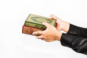 Koran in hand  holy book of Muslims  public item of all muslims photo