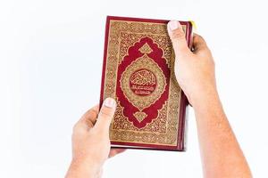 Koran in hand  holy book of Muslims  public item of all muslims photo