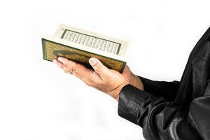 Koran in hand  holy book of Muslims  public item of all muslims photo