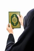 Koran in hand  holy book of Muslims public item of all muslims Koran in hand muslims woman photo