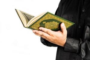 Koran in hand  holy book of Muslims  public item of all muslims photo