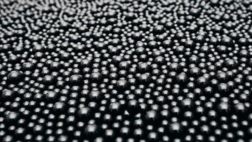 textura de fondo de bolas negras reflejadas - moléculas de aceite foto