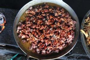 The process of cooking tongseng using a stove in close up, tongseng is traditional food from central java indonesia. thera are tongseng goat beef or chicken photo