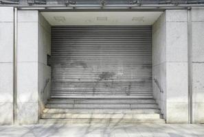 closed department store with rolling shutters - business closure photo