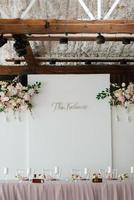 The presidium of the newlyweds in the banquet hall of the restaurant photo