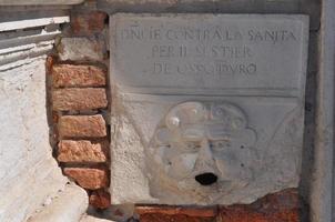 Ancient mask in Venice, Italy photo