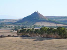 Ruins of ancient Sunuxi Nuraghe megalithic building in Sardinia, photo