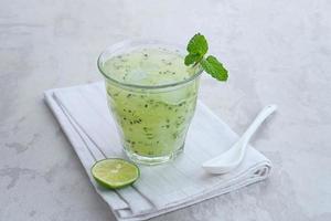 Es Timun Serut, a typical Indonesian drink made from shaved cucumber with syrup, lime and basil seeds. Popular during ramadan. photo