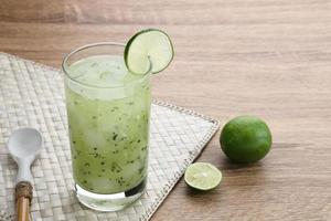 Es Timun Serut, a typical Indonesian drink made from shaved cucumber with syrup, lime and basil seeds. Popular during ramadan. photo