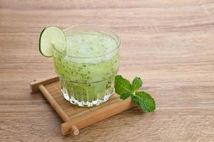 Es Timun Serut, a typical Indonesian drink made from shaved cucumber with syrup, lime and basil seeds. Popular during ramadan. photo