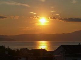 Sunset at sea in Malinska in the island of Krk Croatia photo