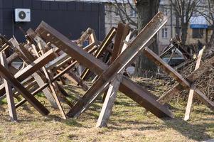 LVIV, UKRAINE  Mar. 12, 2022 War of Russia against Ukraine. Anti-tank hedgehogs in the streeet. The city is ready for defense. photo