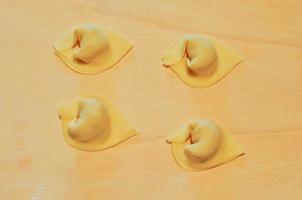 Agnolotti pasta typical of the Piedmont region of Italy is made photo