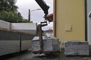 loading or unloading of stone tiles photo