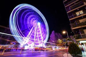 Ferris wheel at night at the fair in Granada.